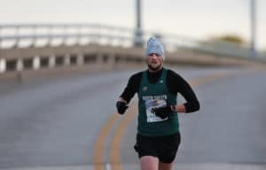 Grand Forks Half Marathon Runner on Bridge